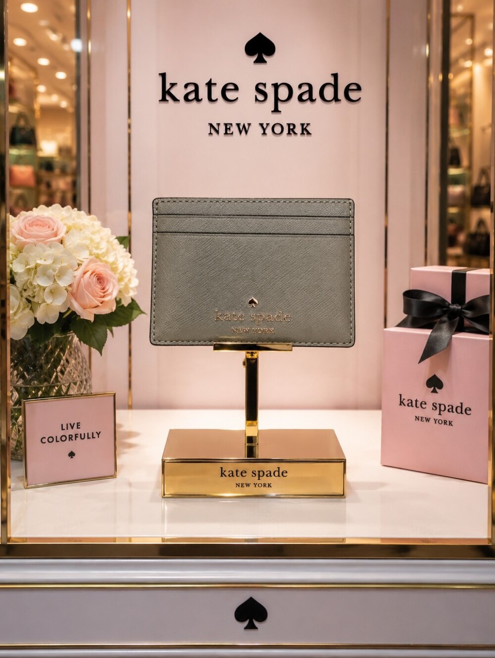 Kate Spade gray saffiano card holder with gold logo